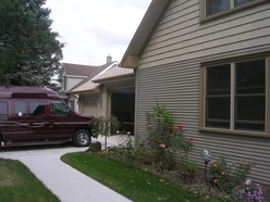 Raised garage door for lift-equipped van